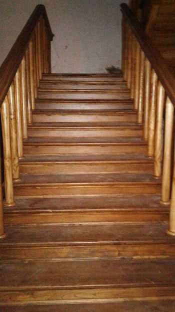 The renovated wooden staircase, from the bottom