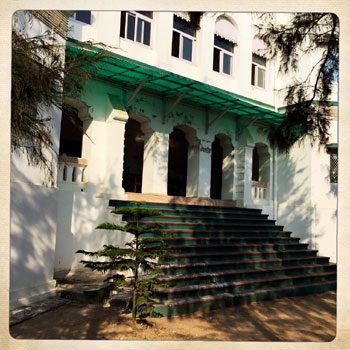 The front steps under the green awning
