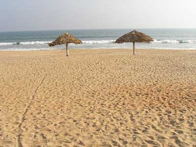 Thatched sunshades on the beach in front of the Z Hotel