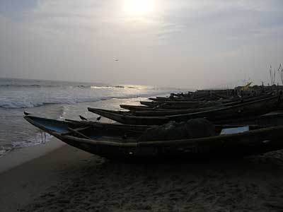 Fishing boats drawn up on the beach in front of the Z Hotel