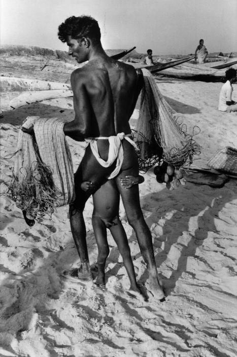 A Puri fisherman and his son on the sand, photographed by Henri Cartier-Bresson